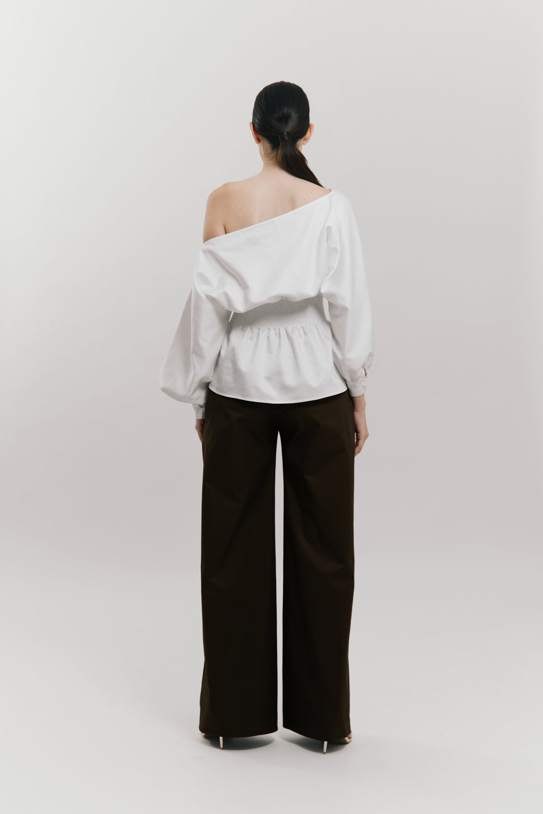 Blusa manga larga con detalle nido de abeja