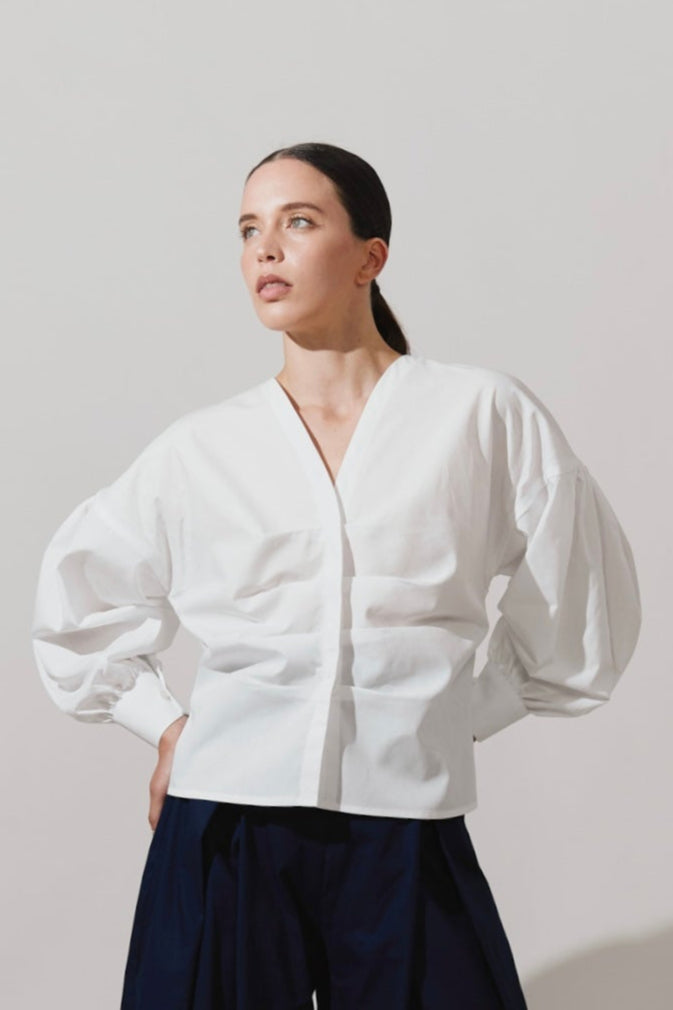 Blusa de pliegues