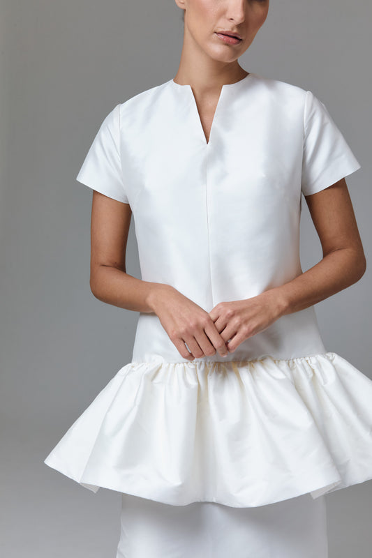 Top largo con mangas cortas y peplum