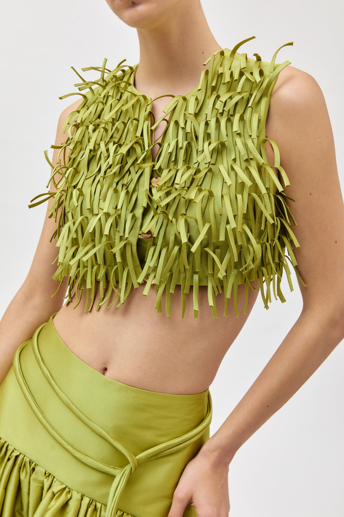 Chaleco crop con flecos