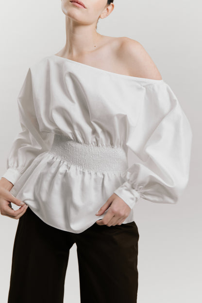 Blusa manga larga con detalle nido de abeja