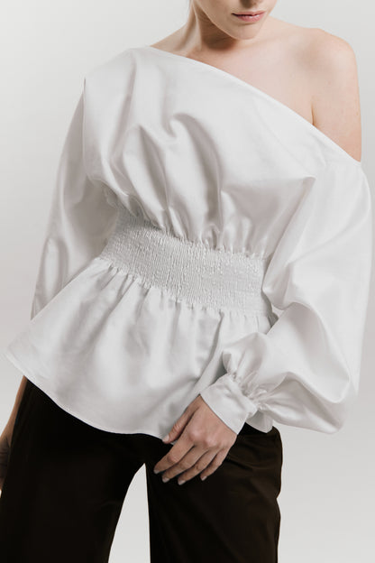 Blusa manga larga con detalle nido de abeja