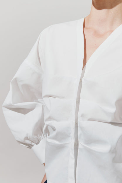 Blusa de pliegues