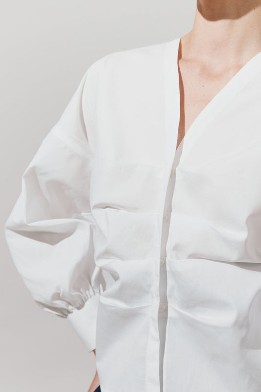 Blusa de pliegues