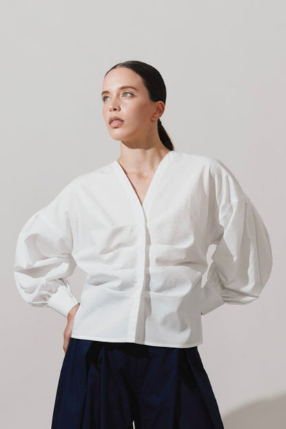 Blusa de pliegues