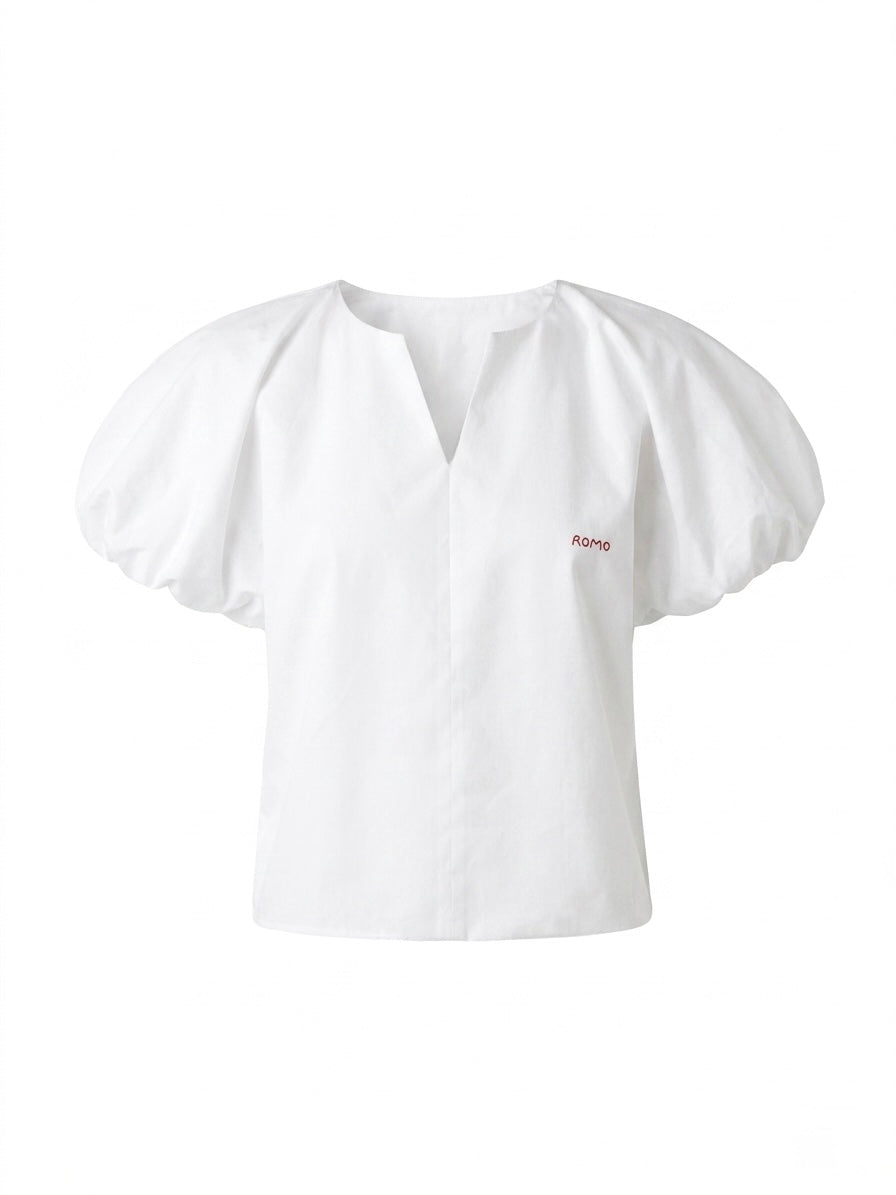 Blusa de mangas abullonadas y cuello en V
